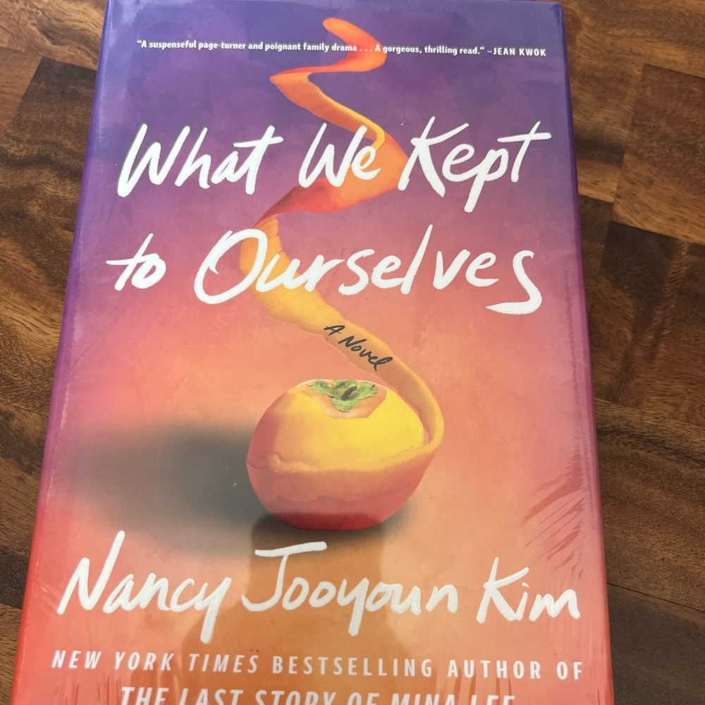 What We Kept to Ourselves by Nancy Jooyoun Kim - Orange & Purple Cover